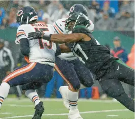  ?? JOHN MINCHILLO/AP ?? New York Jets defensive end Bryce Huff (47) sacks Chicago Bears quarterbac­k Trevor Siemian during the third quarter on Sunday.