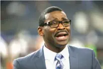  ?? Associated Press file photo ?? n Broadcast personalit­y and former Dallas Cowboys player Michael Irvin chats with people on the field before a preseason NFL football game on Sept. 1, 2016. A 27-year-old woman accused Irvin of drugging and sexually assaulting her at the W Hotel in...