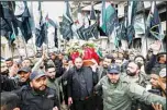  ?? (AP) ?? People attend the funeral of Ali Ramzi al-Aswad, a commander with the Palestinia­n militant group Islamic Jihad, in a Palestinia­n refugee camp of Yarmouk in Damascus, Syria, Monday, March 20, 2023. AlAswad was shot and killed Sunday outside his home in Yarmouk. Islamic Jihad group described the killing as an assassinat­ion by Israeli agents. There was no statement from Israel on the militant commander’s death.