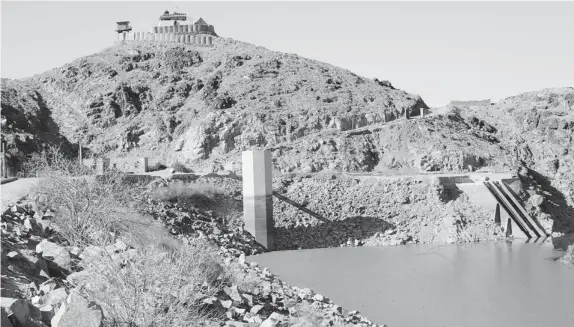  ?? DAVID PUGLIESE/Postmedia News ?? The Dahla Dam is full of silt (visible in this photo), reducing its effectiven­ess for farmers in Kandahar Province who rely on water from irrigation ditches fed by the dam. Canada spent
$50 million on the dam but it will take another $100 million to...