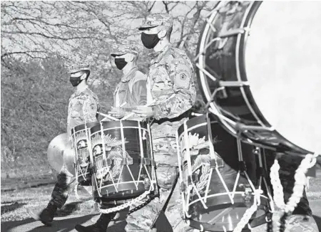  ?? PAUL W. GILLESPIE/BALTIMORE SUN MEDIA ?? The band, under the direction of drum major Staff Sergeant James Old, marches around Ft. Meade. The U.S. Army Field Band practices there.