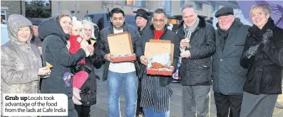  ??  ?? Grub up Locals took advantage of the food from the lads at Cafe India