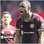  ??  ?? HEARTS-WARMING Uche Ikpeazu celebrates his goal