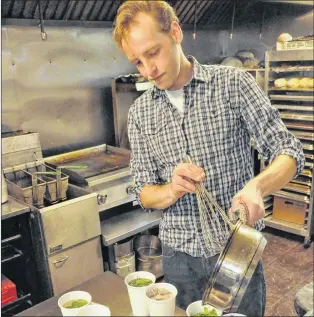  ?? KENN OLIVER/THE TELEGRAM ?? The Angry Urchin’s Cody Woodland works on a test batch of syrups that will be used to create some of the unique Newfoundla­nd-inspired cocktails offered at the Portugal Cove-st. Philip’s restaurant.