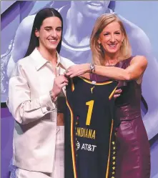 ?? GETTY IMAGES VIA AFP ?? Caitlin Clark poses with WNBA Commission­er Cathy Engelbert after being selected as first overall pick by Indiana Fever during the 2024 WNBA Draft on Monday in New York City.