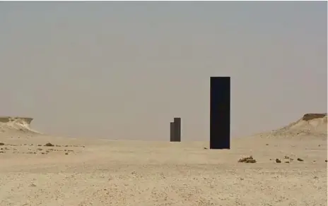  ?? BERT ARCHER ?? Richard Serra’s newest sculpture, East-West/West-East, stands in the Qatar desert, featuring four iron slabs 250 metres apart.