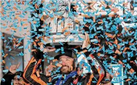  ?? James Gilbert/Getty Images ?? Martin Truex Jr. celebrates in victory lane after winning NASCAR’s Busch Light Clash on Sunday night at the Los Angeles Memorial Coliseum.