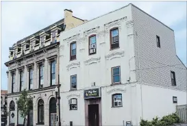  ?? SPECIAL TO THE EXAMINER ?? The Morrow Building and the Little Windsor Hotel on Brock Street by George. Notice the sharp architectu­ral features of the Morrow Building with its fine mansard roof and stunning fenestrati­on (windows) that were characteri­stic of the Second Empire Style.