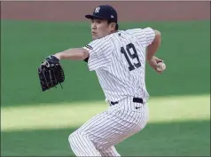  ?? Jae C. Hong / Associated Press ?? New York Yankees starting pitcher Masahiro Tanaka throws against the Tampa Bay Rays during Game 3 of the American League Division Series on Oct. 7.