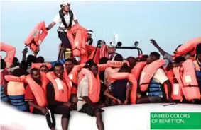  ??  ?? Publicity: The Benetton advert using an image of rescued migrants