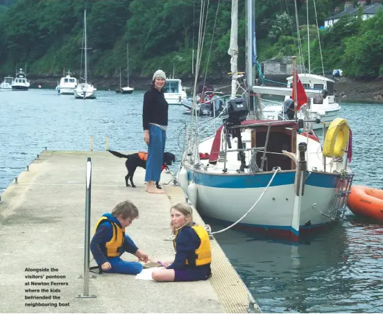  ??  ?? Alongside the visitors’ pontoon at Newton Ferrers where the kids befriended the neighbouri­ng boat