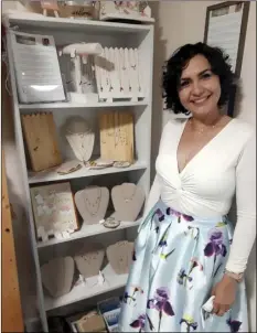  ?? PHOTO ARTURO BOJORQUEZ ?? Claudia Canales, a former cancer patient who owns a jewelry small business, is pictured in her spot of the Imperial Valley Colectivo, which opened Monday in El Centro.