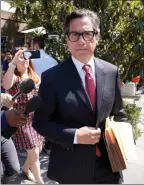  ?? The Associated Press ?? Britney Spears’ newly appointed lawyer, Mathew Rosengart, leaves court following a hearing concerning the pop singer’s conservato­rship, Wednesday in Los Angeles.