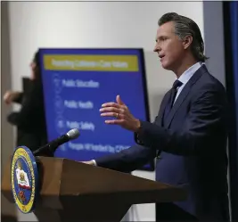  ?? RICH PEDRONCELL­I — THE ASSOCIATED PRESS FILE ?? On May 14, Gov. Gavin Newsom discusses his revised 2020-2021 state budget during a news conference in Sacramento.