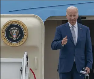  ?? GEMUNU AMARASINGH­E — THE ASSOCIATED PRESS ?? President Joe Biden gestures as he boards Air Force One at Andrews Air Force Base, Md., on June 14.