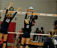  ??  ?? ARIZONA WESTERN’S MAFE SANDOVAL spikes the ball over the head of Pima’s Kayli Riesgo (2) during the third set of Wednesday night’s match at AWC.