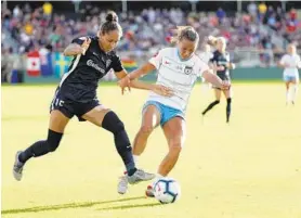  ?? BRIAN CASSELLA/CHICAGO TRIBUNE ?? North Carolina Courage defender Jaelene Hinkle (15) and Chicago Red Stars defender Sarah Gorden (14) battle during the National Women's Soccer League championsh­ip .