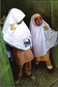  ??  ?? While Salima and her friends are waiting to sell delicacies to pupils of Kofar Nasarawa Model School, their counterpar­ts are going through structured childhood developmen­t