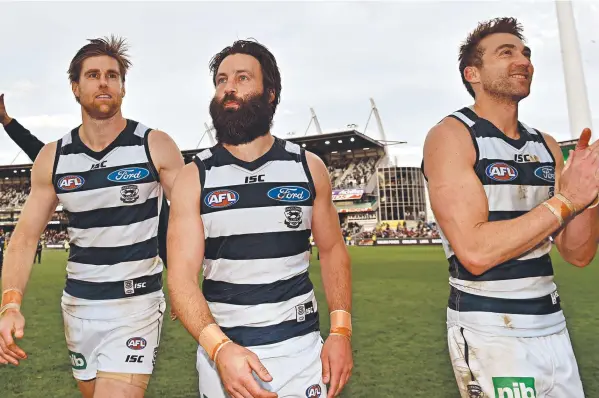  ?? Picture: JULIAN SMITH ?? FINAL HOME GAME?: Tom Lonergan, Jimmy Bartel and Corey Enright take in the crowd after Geelong’s thumping win over Melbourne.