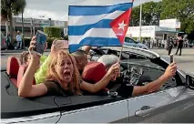  ?? PHOTO: REUTERS ?? People celebrate after the announceme­nt of the death of Cuban revolution­ary leader Fidel Castro, in the Little Havana district of Miami, Florida.