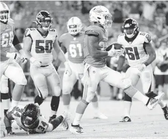  ?? MICHAEL REAVES/GETTY ?? Dolphins running back Myles Gaskin scores a touchdown Thursday night against the Falcons during the fourth quarter of their preseason game at Hard Rock Stadium in Miami Gardens.