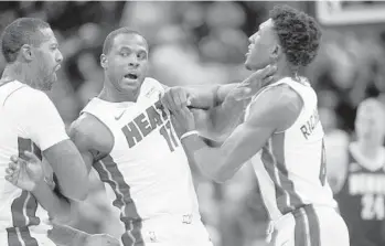  ?? DAVID ZALUBOWSKI/AP ?? Guard Dion Waiters, center, during Friday’s loss to Denver, returned to South Florida for the birth of his daughter. He is expected back at some point on the team’s present road trip.