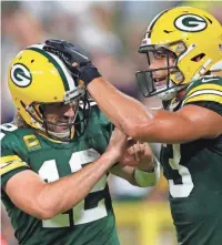  ?? DAN POWERS/USA TODAY NETWORK-WISCONSIN ?? Green Bay Packers quarterbac­k Aaron Rodgers (left) and wide receiver Allen Lazard were each fined $14,650 by the NFL for violations of COVID-19 protocols.