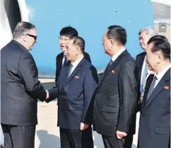  ?? MATTHEW LEE / AFP / GETTY IMAGES ?? U.S. Secretary of State Mike Pompeo, left, is greeted in Pyongyang on Wednesday. Pompeo secured the release of three American prisoners ahead of a planned summit between Kim Jong Un and U.S. President Donald Trump.