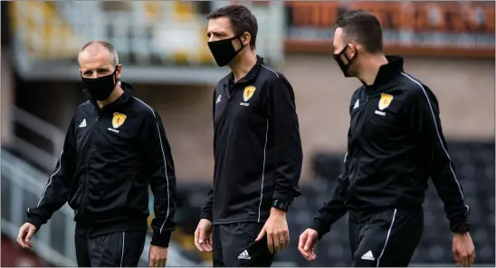  ??  ?? Kevin Clancy (centre) and the rest of the SPFL officials have been put through their paces in training in the lead-up to the season