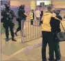  ?? AP PHOTO ?? Armed police stand guard at Manchester Arena after reports of an explosion at the venue during an Ariana Grande concert in Manchester, England, on Monday. Police says there are “a number of fatalities” after reports of an explosion at the concert.