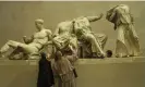  ?? Martin Argles/The Guardian ?? Experts examine statues from the Parthenon frieze at the British Museum. Photograph: