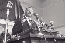  ?? ASSOCIATED PRESS ?? Civil rights leader Martin Luther King Jr. speaks in Atlanta in 1960. King, who championed civil, human and voting rights, will be honored Monday during the national holiday that bears his name.