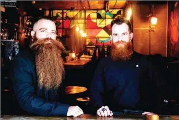  ?? AFP ?? Bar Pinto (right) and Gilad Levi – founders of ‘Beard Exemptions for All’, a campaign challengin­g Israeli military rules compelling all male troops to be clean shaven – pose for a photo in Tel Aviv last month.