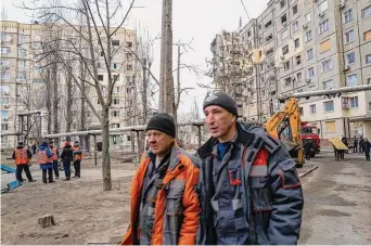  ?? Spencer Platt/Getty Images ?? As the search and rescue at a destroyed apartment building officially ends, cleanup and aid distributi­on to those that lost apartments continue at the site where some 40 victims, including children, were killed on Tuesday in Dnipro, Ukraine. A Russian missile hit the apartment building on Saturday, part of fresh wave of missiles launched by Russia. The Ukrainian president said his forces shot down 20 of 30 missiles fired by Russia on Saturday.