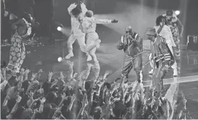  ?? ANGELA WEISS/AFP/GETTY IMAGES ?? Busta Rhymes, right, adds old-school energy to the MTV Video Music Awards at Barclays Center on Sunday in New York.