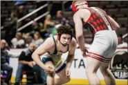  ?? NATE HECKENBERG­ER - FOR MEDIANEWS GROUP ?? Spring-Ford’s Louis Carbajal stays in position against Hazelton’s Seth Hunsinger in a 3-2 win in the 195-pound blood round.