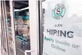  ?? JOHN RAOUX/ASSOCIATED PRESS ?? A job posting is displayed near the entrance of a restaurant in Orlando, Florida. On Tuesday, the Labor Department reported job openings dropped in September.
