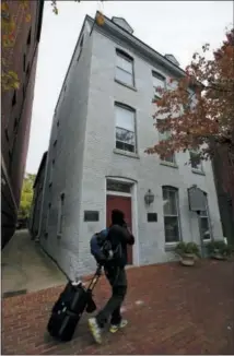  ?? ALEX BRANDON — ASSOCIATED PRESS FILE PHOTO ?? This file photo taken Oct. 31, 2013 shows a person walking past the Freedom House Museum in Alexandria, Va.