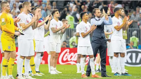  ??  ?? England manager Gareth Southgate and his player applaud fans after the match against Belgium.