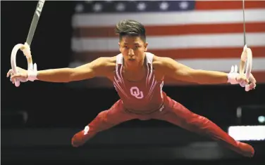  ?? Sean M. Haffey / Getty Images ?? Oklahoma’s Yul Moldauer competes on the rings on his way to the U.S. all-around title in Anaheim.