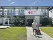  ?? Carolyn Cole Los Angeles Times ?? ISAAC IGNATIUS, president of Phi Kappa Tau, moves belongings from his fraternity house at USC.