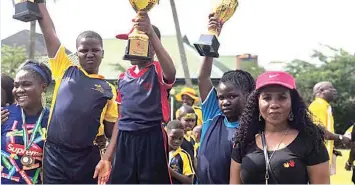  ??  ?? Winners and their supporters display their trophies at the recently concluded Tender Palms School’s Inter-house Competitio­n held at the school’s playground at Sanya Ogunbanjo, Arowojebe Estate, Mende Maryland, Lagos.