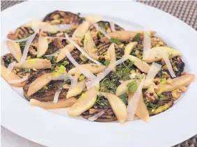  ?? DENISE MILLER/FOR THE JOURNAL ?? Elegant Eggplant, Pear and Pecorino Salad is best served warm immediatel­y after it comes together.