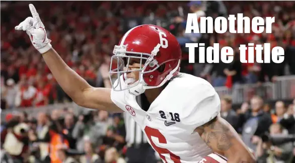  ?? David Goldman, AP) (Photo by ?? Alabama wide receiver DeVonta Smith celebrates his touchdown in overtime to give the Crimson Tide a 26-23 win over Georgia to claim the national championsh­ip.