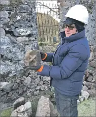  ?? Photograph­s: Imagine Alba. ?? Volunteers, including Steve Barlow and Andy Buntin, helped move nearly 40 tonnes of rubble and spread five tonnes of gravel to protect the site during the nine-day dig at Kilbride; Dr Clare Ellis of Argyll Archaeolog­y with an architectu­ral fragment featuring a dogtooth motif from the 13th-century church that was excavated during the dig; Dr Ellis and Hilary McLauchlan of Argyll Archaeolog­y, along with a volunteer and Seymour Adams, moved 22.5 cubic metres of rubble and worked on removing an invasive sycamore root in the walls.