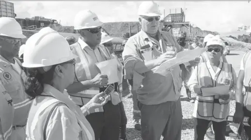  ??  ?? Minister of Natural Resources, Raphael Trotman (third from right) and Minister within the Ministry of Finance, Jaipaul Sharma (right) being given an overview of the Aurora Gold Mine by General Manager, Victor Rozon (second from right) (Department of...