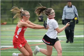  ?? MEDIANEWS GROUP FILE PHOTO ?? Upper Dublin’s Mack Moore works to get past Souderton’s Caroline Kelly last season.