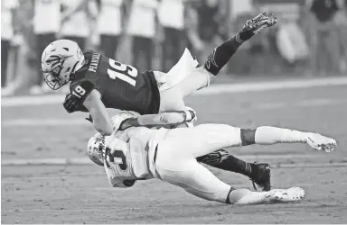  ?? CHERYL EVANS/THE REPUBLIC ?? Arizona State receiver Ricky Pearsall Jr. is tackled by Colorado safety Derrion Rakestraw during a game at Sun Devil Stadium on Sept. 21.