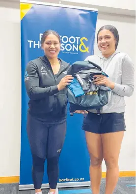  ?? Photo / Supplied ?? Silver Fern Peta Toeava (left) presenting Te Awamutu’s Liza Ball with her New Zealand Secondary Schools playing kit.