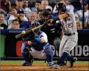  ?? ASSOCIATED PRESS ?? IN THIS OCT. 25 FILE PHOTO, Houston Astros’ Jose Altuve hits a home run against the Los Angeles Dodgers during the 10th inning of Game 2 of the World Series in Los Angeles. Altuve was named The Associated Press Male Athlete of the Year on Wednesday.